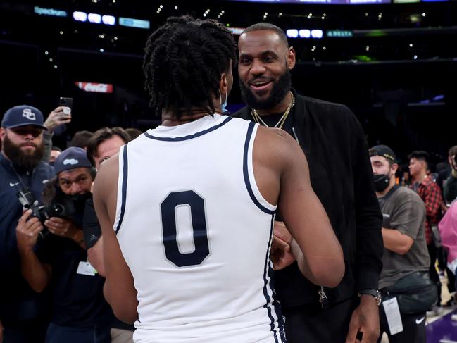 LeBron James talks with his son Bronny James. Picture: Getty Images/AFP