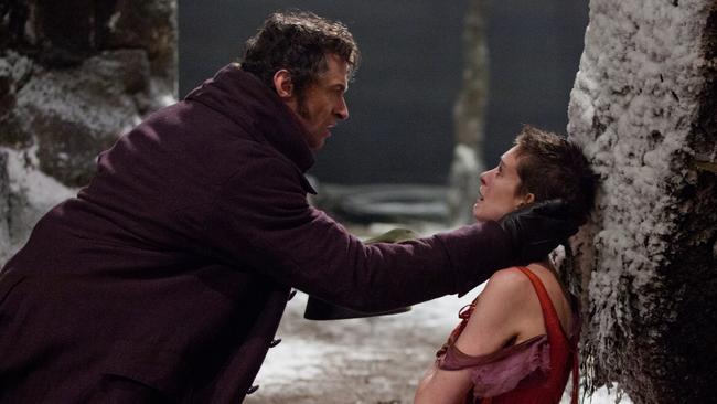 Hugh Jackman as Jean Valjean, left, and Anne Hathaway as Fantine in a scene from Les Miserables