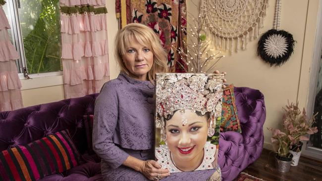 Sonia Anderson holding an image of her daughter Bianca Girven, who was murdered by her partner 9 years ago. Photo: Glenn Hunt / The Australian