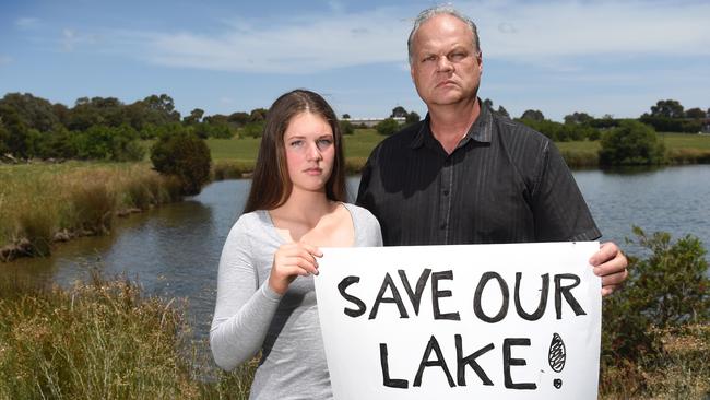 Ferntree Gully's Mark Glazebrook and his daughter Taya want a lake at the site to be saved. Picture: Kylie Else