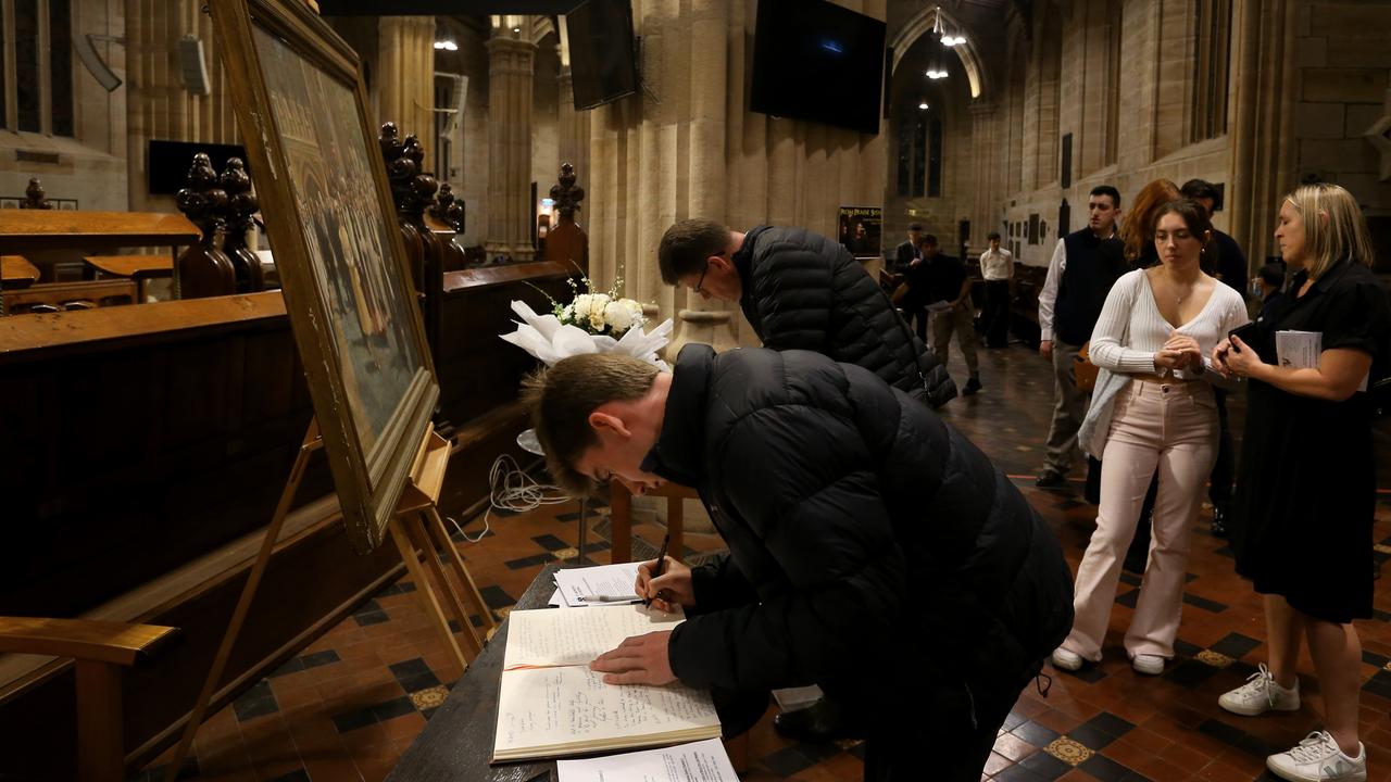 Sydney, Australia: Sydneysiders leave messages of condolences for Queen Elizabeth II at St. Andrew‘s Cathedral on September 19, which included a telecast of the funeral. Picture: Getty Images