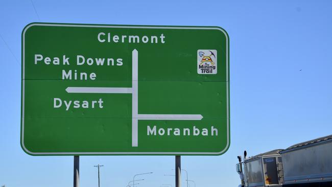 The road sign on the Peak Downs Highway showing directions to the Peak Downs Mine, Dysart, Clermont and Moranbah. Picture: Tara Miko