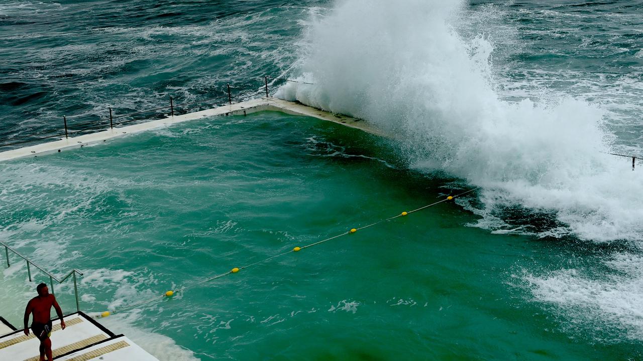 Large waves crash across Bondi pool as the east coast of the state continues to be inundated by wet weather on Sunday. Picture: Jeremy Piper