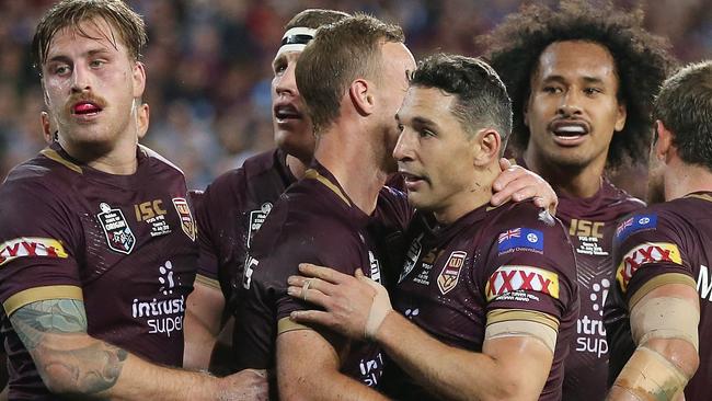 Billy Slater celebrates with his Maroons teammates.