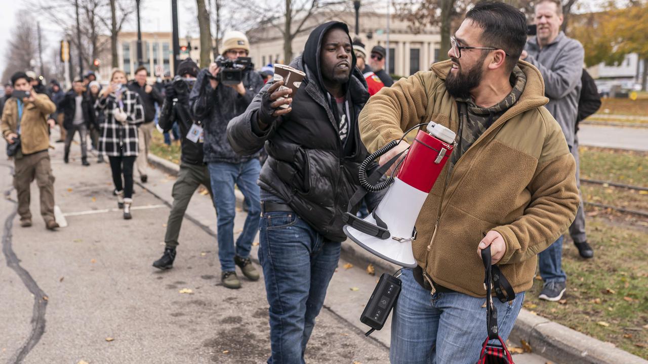 A Black Lives Matter supporter, left, scuffles with a supporter of Kyle Rittenhouse. Picture: Nathan Howard/Getty Images/AFP