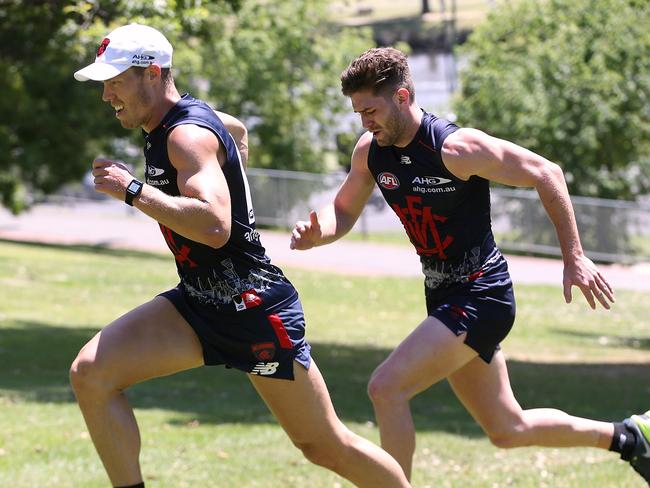 Jake Melksham and Tom Bugg lead the way as Melbourne players took part in gruelling hill sprints at The Tan. Picture: Wayne Ludbey