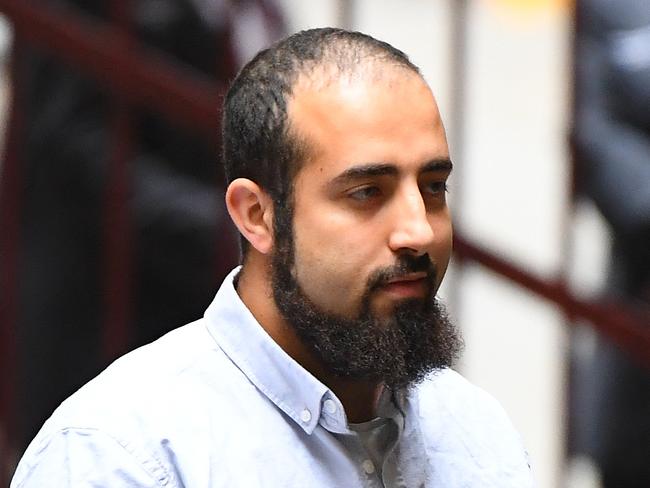 Hamza Abbas arrives to the Supreme Court of Victoria, Melbourne, Friday, November 29, 2019. Sentence for Christmas Day terror attack plotters Abdullah Chaarani, Ahmed Mohamed and Hamza Abbas. The trio planned to detonate bombs and machetes to attack people at Federation Square in Melbourne. (AAP Image/James Ross) NO ARCHIVING