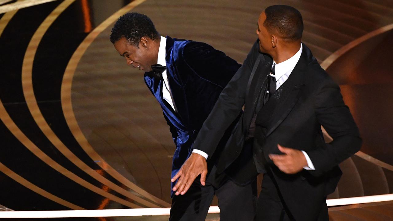 Will Smith (R) slaps Chris Rock onstage. Picture: Robyn Beck / AFP