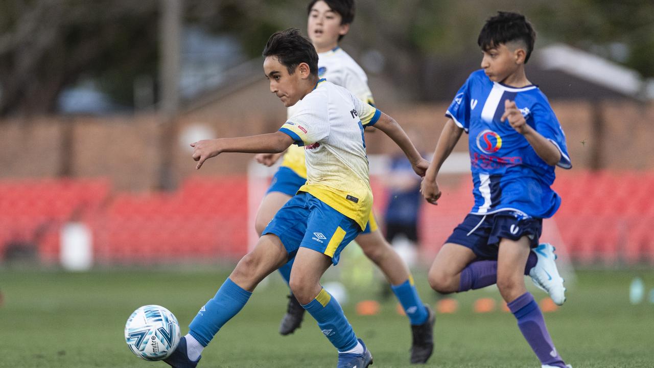 Alhassan Hussen (left) of USQ FC and Samr Qaeerani of Rockville Rovers White in Football Queensland Darling Downs Community Juniors U13 Div 1 Maroon grand final at Clive Berghofer Stadium, Friday, August 30, 2024. Picture: Kevin Farmer