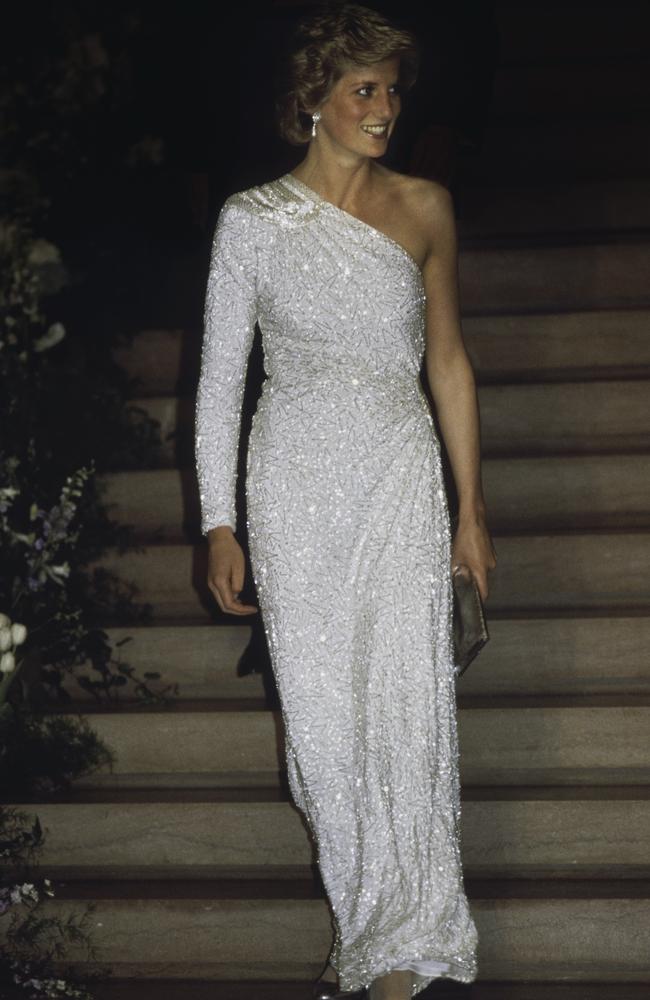Diana’s Style: 1985 - Diana wears a white, crystal-beaded, silk chiffon, assymetric gown by designer Hachi to attenda gala dinner at the National Gallery in Washington. Picture: Getty