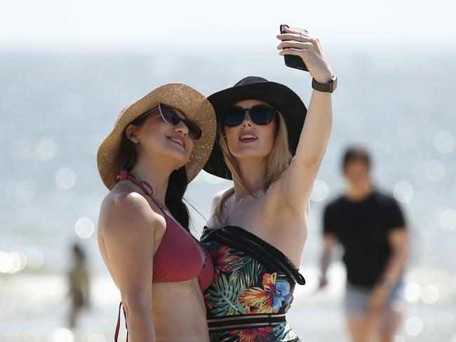 MELBOURNE, AUSTRALIA - NewsWire Photos JANUARY 10, 2020 : People take a selfie at St Kilda beach as the temperature rises across Melbourne. Picture : NCA NewsWire / Daniel Pockett