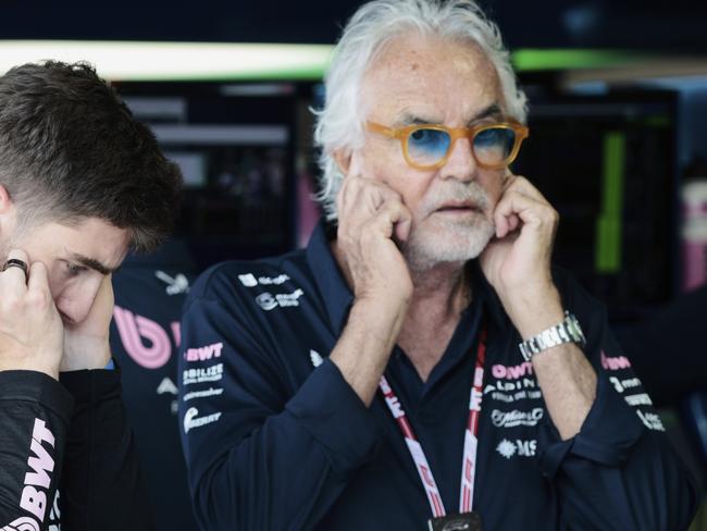 Alpine driver Jack Doohan of Australia and Flavio Briatore stand in the pit area before the qualifying session for the Formula One Miami Grand Prix auto race at the International Autodrome, Saturday, May 3, 2025, in Miami Gardens, Fla. (Shawn Thew/Pool Photo via AP)