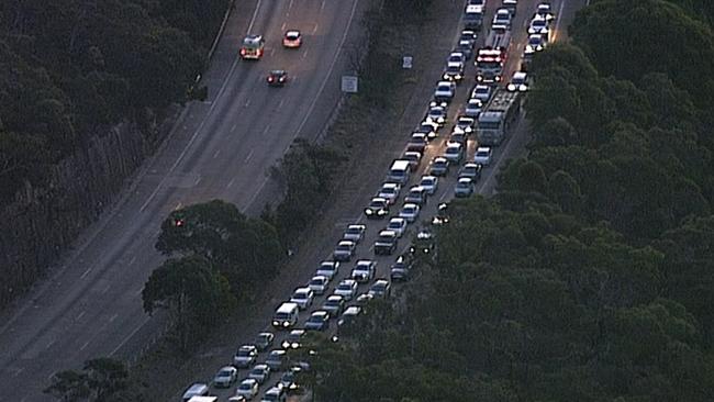 The scene of a multi vehicle crash and truck fire on the M1 where northbound traffic queued nine kms and one km southbound. Picture: Seven News