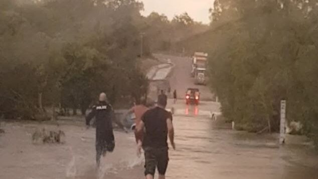 Coen police Sergeant David McCarthy and Senior Constable Carey Allen in pursuit of a man after he allegedly tried to drive through flood waters at Archer River.