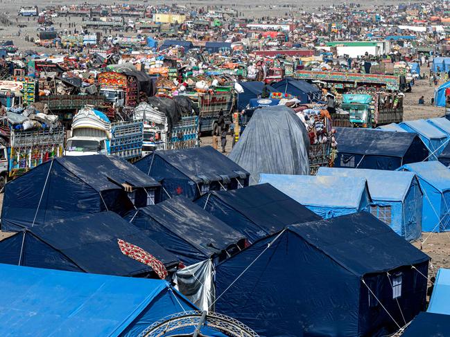 Makeshift camps and trucks of Afghan refugees who arrived from Pakistan at the Afghanistan-Pakistan Torkham border on Thursday. Picture: AFP