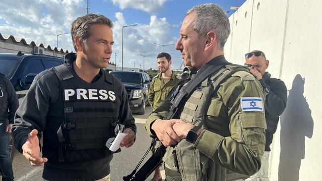 Lachlan Murdoch with Rear Admiral Daniel Hagari in southern Israel.