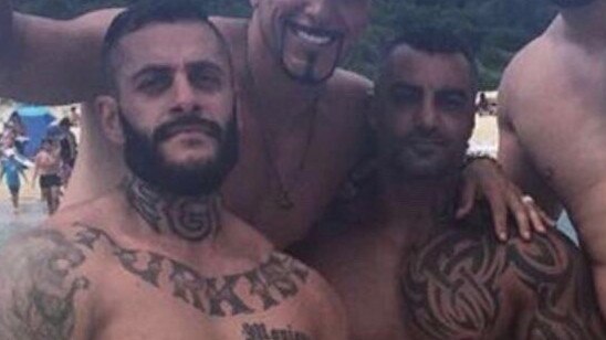 Yusuf Nazlioglu (left) was found not guilty of the murder of Mick Hawi (right with tattoo on chest).