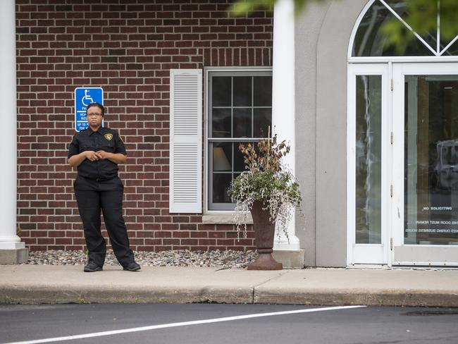 Dental surgery ... a security guard stands outside Walter Palmer's office in Bloomington, Minnesota, when it reopened on Monday August 17. Picture: Renee Jones Schneider/Star Tribune via AP