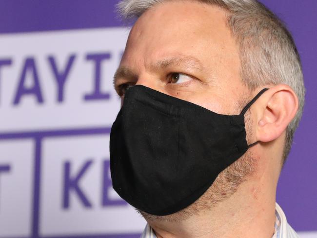 MELBOURNE, AUSTRALIA - OCTOBER 31: Victoria's Chief Health Officer Professor Brett Sutton wearing a mask listens during a press conference on October 31, 2020 in Melbourne, Australia. Victoria has recorded one new COVID-19 case and no deaths in the past 24 hours. Today's government COVID-19 update is the first media conference premier Dan Andrews has not attended since July 3. The Victorian premier attended 120 consecutive press conferences to update the public on COVID-19 case numbers during the state's coronavirus lockdown. Lockdown restrictions in Melbourne were lifted on 28 October, with people now able to leave their homes for any reason. (Photo by Asanka Ratnayake/Getty Images)