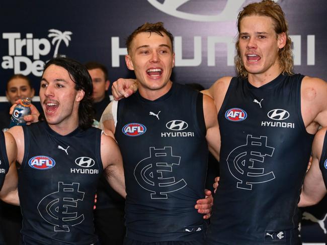 MELBOURNE, AUSTRALIA - JUNE 08: Carlton players sing the song after the round 13 AFL match between Carlton Blues and Essendon Bombers at Melbourne Cricket Ground, on June 08, 2025, in Melbourne, Australia. (Photo by Quinn Rooney/Getty Images)