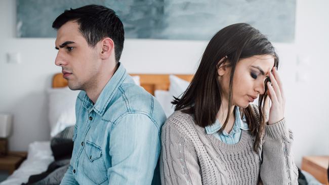 Young couple arguing in the bedroom