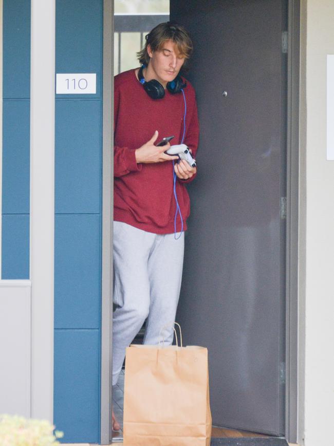 Adelaide’s Josh Worrell picks up food left for him at the Barossa Valley resort. Picture: Brenton Edwards