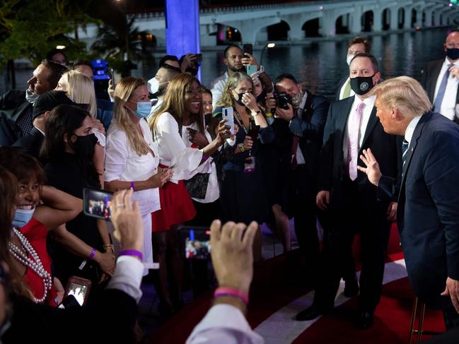 Donald Trump speaks with audience members who participated in the town hall. Picture: AFP