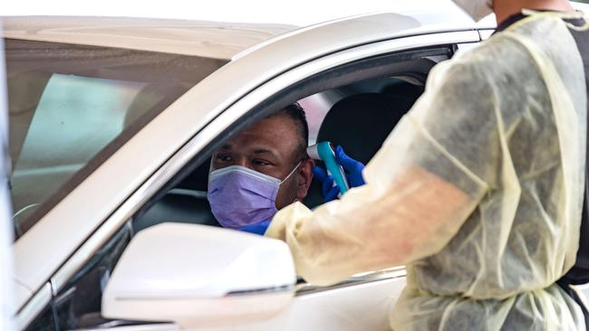 A man has his temperature taken at a COVID-19 testing centre in Austin, Texas, on Tuesday. Picture: Getty Images