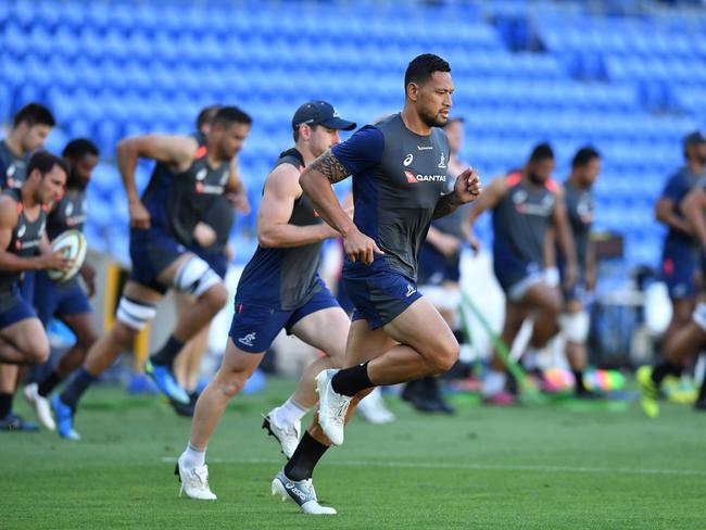 Israel Folau stretches out his injured ankle. Picture: AAP