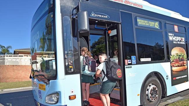 Kayden Beattie, 8, gets on his bus to school. (AAP IMAGE / Troy Snook)