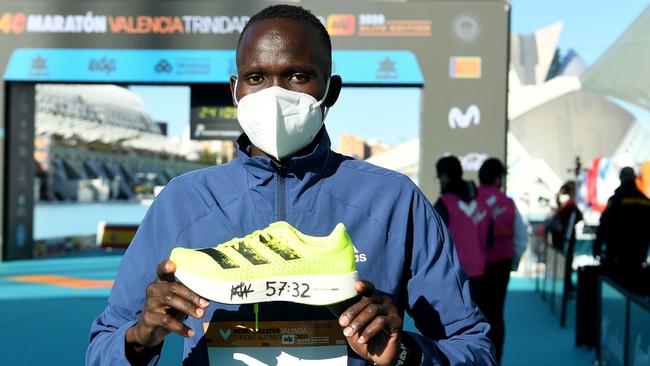 Kibiwott Kandie poses with the Adidas Adizero Adios Pro after breaking the men’s half-marathon world record in Valencia, Spain, in December. Picture: Getty Images