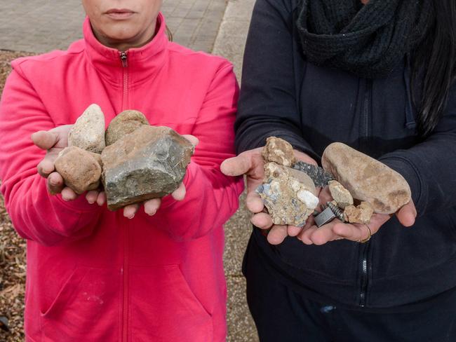 ADELAIDE, AUSTRALIA - NewsWire Photos JUNE 16, 2021 - Local residents Eda (0416983234), left and Tash (0481741373) in Wattlebird Drive at Burton with rocks thrown by vandals that have damaged property. Picture: NCA NewsWire / Brenton Edwards