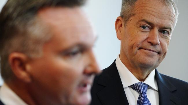 Opposition Leader Bill Shorten listens intently as Shadow Treasurer Chris Bowen speaks during a visit to St John of God Midland Public hospital