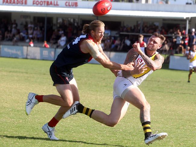 Round 4 QAFL Australian rules game between Surfers Paradise Demons (blue) and Labrador Tigers at Sir Bruce Small Park. Photo of Surfers Paradise player Trent Goldfinch (left) and Labrador’s Bryce Retzlaff (right). Photo by Richard Gosling