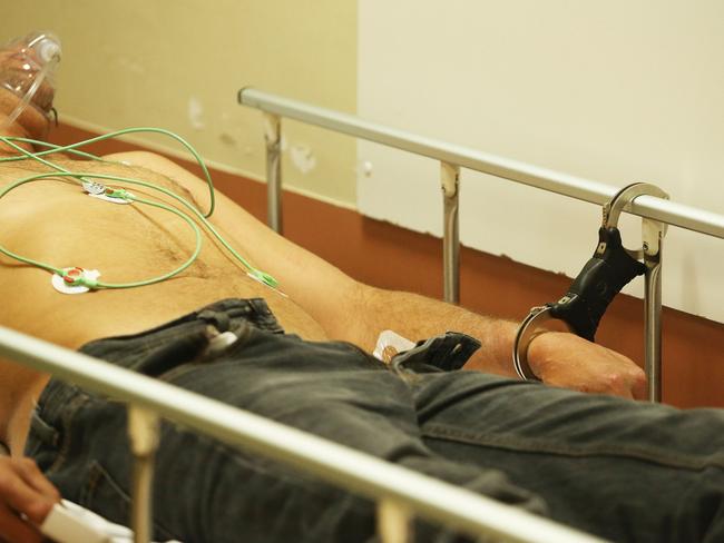 A man is brought to the Emergency Department at Royal Perth in a state of psychosis and is treated by the emergency medical staff. Picture: Gary Ramage