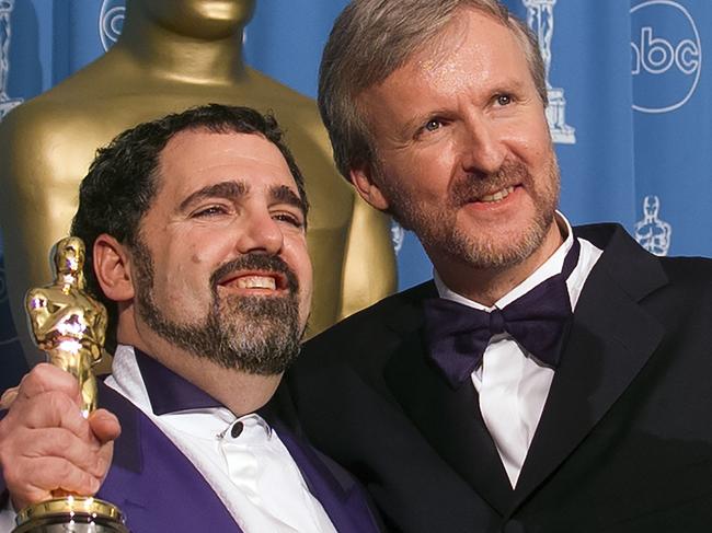 LOS ANGELES, CALIFORNIA - MARCH 23 : Oscar Winners Producer Jon Landau and Director James Cameron backstage with the Oscar Award for Best Picture 'Titanic' at Academy Awards Show, March 23, 1998 in Los Angeles, California. (Photo by Bob Riha, Jr./Getty Images)