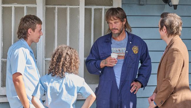 Trent Dalton on the set of the Netflix adaptation of Boy Swallows Universe, pictured at second right is, star Travis Fimmel. Picture: Kane Skennar / Netflix