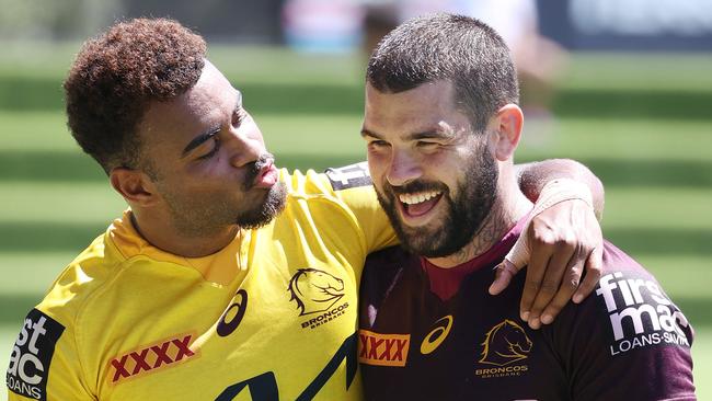 Ezra Mam showing some love for Adam Reynolds at Brisbane Broncos training. Picture: Liam Kidston