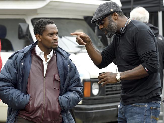 Elba (right) on the London set of his first film as director, Yardie, with actor Aml Ameen in May 2017. Picture: Studiocanal