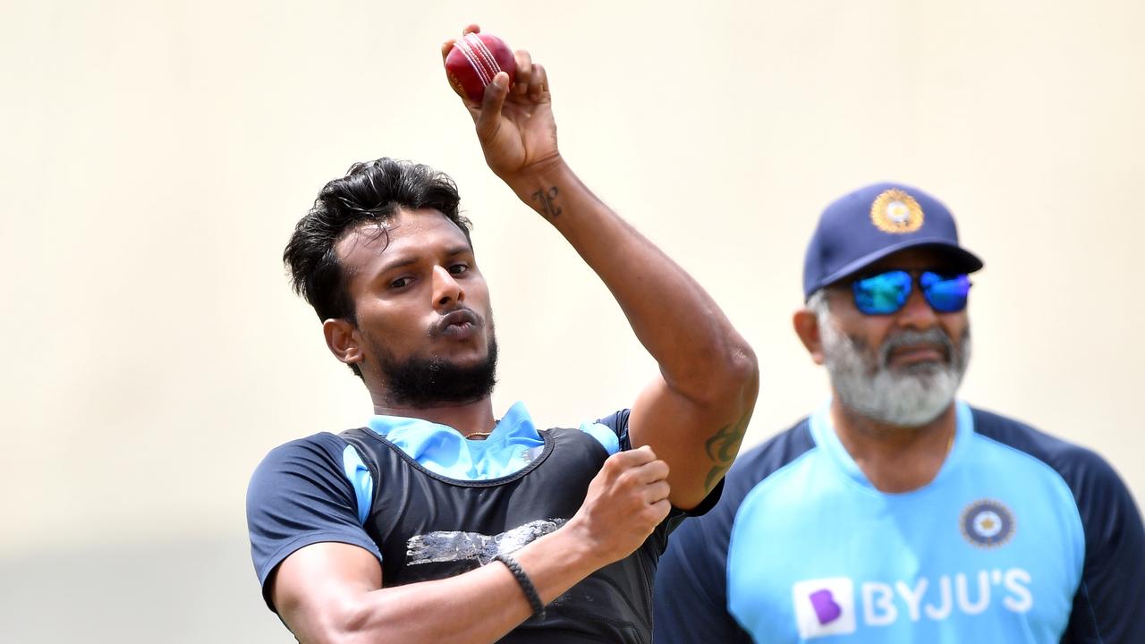 Natarajan bowling for India. Photo by Saeed KHAN / AFP