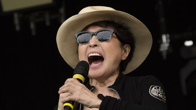 Yoko Ono and the Plastic Ono band perform on the main Pyramid stage at Glastonbury music festival, England, Sunday, June 29, 2014. Thousands of music fans have arrived for the festival to see headliners Arcade Fire, Metallica and Kasabian. (Photo by Joel Ryan/Invision/AP)