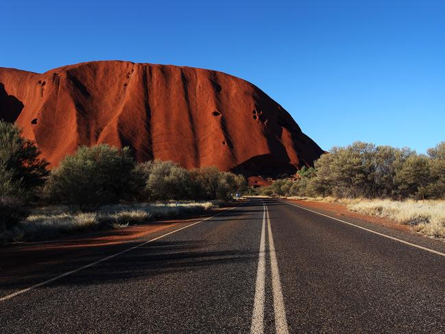 ULURU, AUSTRALIA - AUGUST 12: A view from the roadway of Uluru as seen on August 12, 2019 in the Uluru-Kata Tjuta National Park, Australia. The Uluru-Kata Tjuta National Park board decided unanimously that the climb will close permanently on October 26, 2019. The date coinciding with the hand-back to traditional owners in 1985 and seen by many as a form of reconciliation. The climb deadline date has sparked a considerable boost in tourism, also aided by cooler weather and the introduction of direct flights to Ayers Rock Airport from cities Darwin and Adelaide. According to Parks Australia Uluru has welcomed 244,075 visitors this calendar year, an increase of 18.7%. Sacred to the Yankunytjatjara and Pitjantjatjara people, climbing Uluru (also known as Ayers Rock) is strongly discouraged by them for its cultural significance and their concerns for peoples safety. Over 30 people have died and numerous injured while attempting the steep ascent, less than 20% of park visitors take part in the climb. Known as Anangu land, the arkose sandstone formation, 348 meters high is believed to be half a billion years old. The Uluru-Kata Tjuta National Park, jointly managed by Anangu traditional owners and Parks Australia includes Kata Tjuta (The Olgas) and is recognised by UNESCO as a World Heritage Area. (Photo by Lisa Maree Williams/Getty Images)