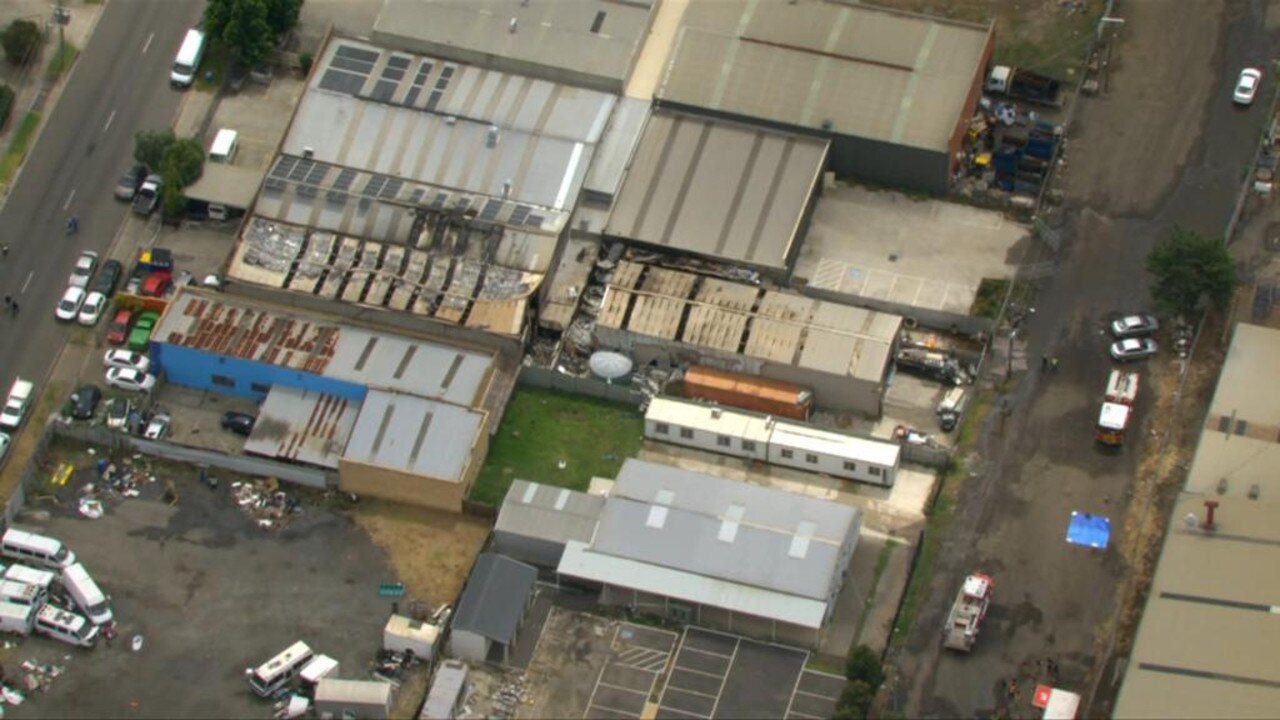 The fire spread out from the mechanical store and spread to a nearby building where two were sleeping. Picture: 7NEWS