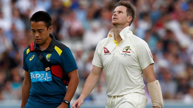 Steve Smith leaves the field for a concussion test after being hit by Jofra Archer. Picture: AFP