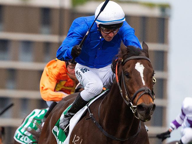 Jockey Kerrin McEvoy rides Trekking to victory in race 8, the Stradbroke Handicap, during Stradbroke Day at Eagle Farm Racecourse in Brisbane, Saturday, June 8, 2019. (AAP Image/Albert Perez) NO ARCHIVING, EDITORIAL USE ONLY