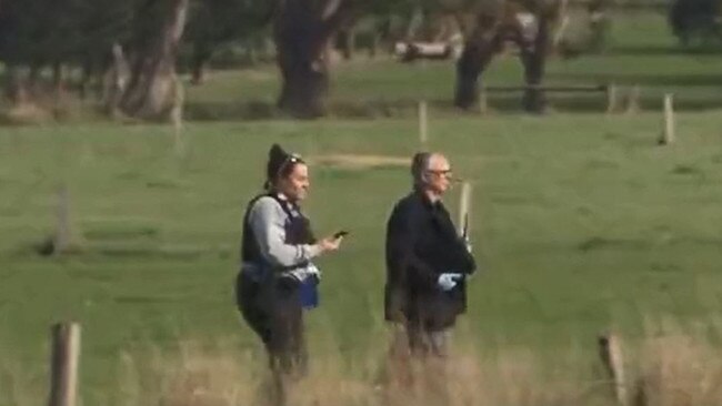 Police scour the area in the wake of the killings. Picture: 7 News