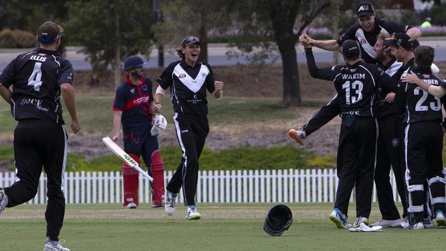 Adelaide University players celebrate taking a wicket during the Twenty20 grand final against East Torrens at Karen Rolton Oval on Sunday Picture: AAP/Emma Brasier