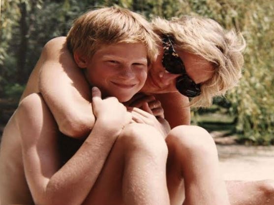 Prince Harry, here with his mother Princess Diana, is expected by many to name the child in her honour if it is a girl.