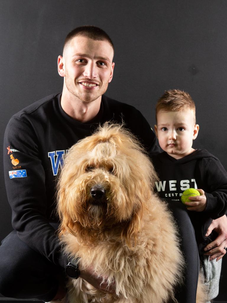 Winning dog Junior for the SA's cutest dog competition with owner Tamara’s son in-law Peter and his son Hunter. Picture: Brett Hartwig