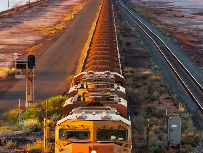 A BHP freight train carrying iron ore travels along a rail track towards Port Hedland, Australia. Picture: Ian Waldie/Bloomberg via Getty Images